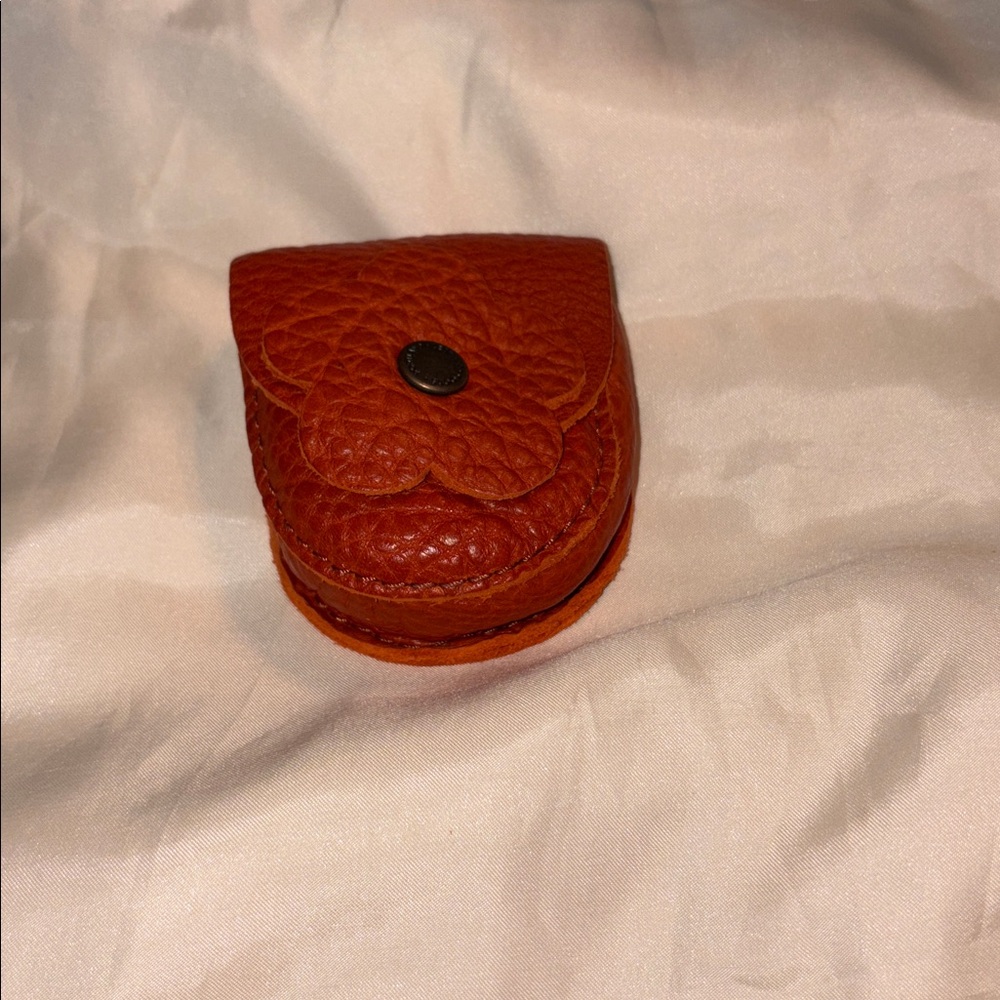 Portland leather koi bag flair with clip for ear buds clip to your bag.